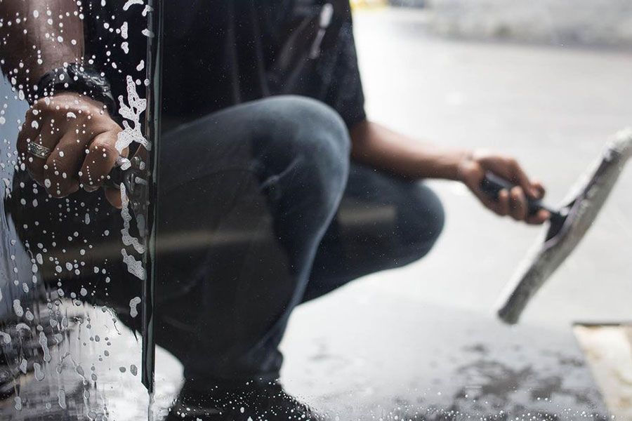 window cleaner cleaning a window